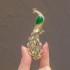 High-end and exquisite emerald green peacock brooch with unique ethnic design